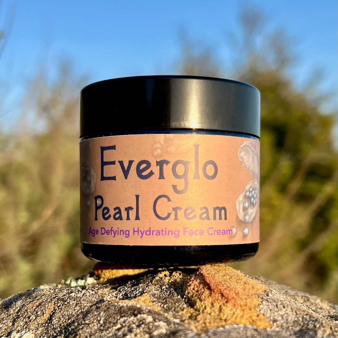 photograph of Everglo Pearl Cream Jar on rock