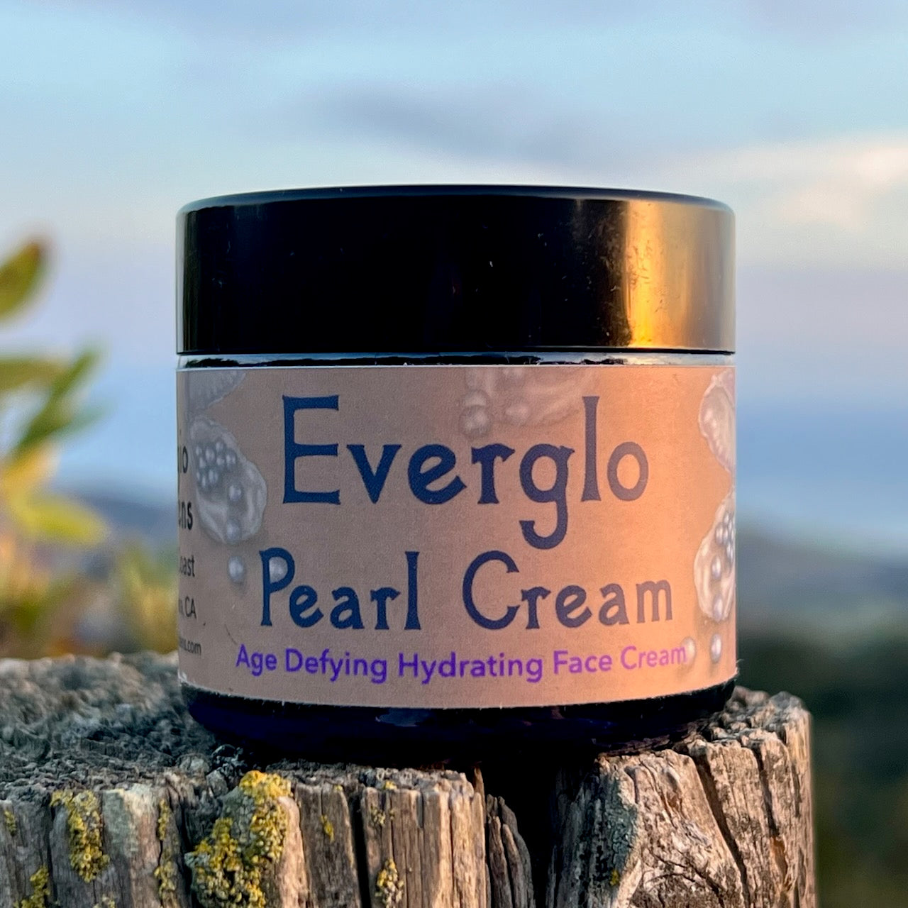 photograph of Everglo Pearl Cream Jar on rock ocean in background