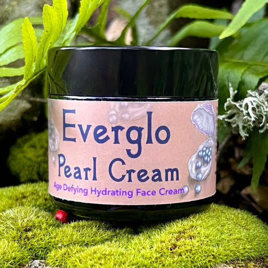 photograph of Everglo Pearl Cream Jar on moss with ferns